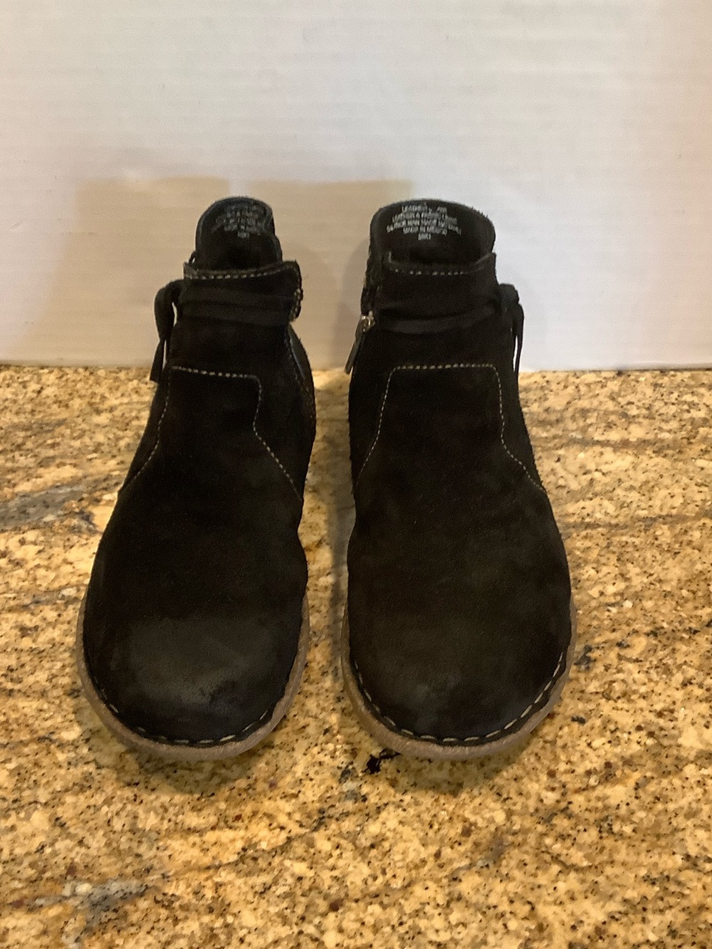 Born black suede booties.  9.5M
